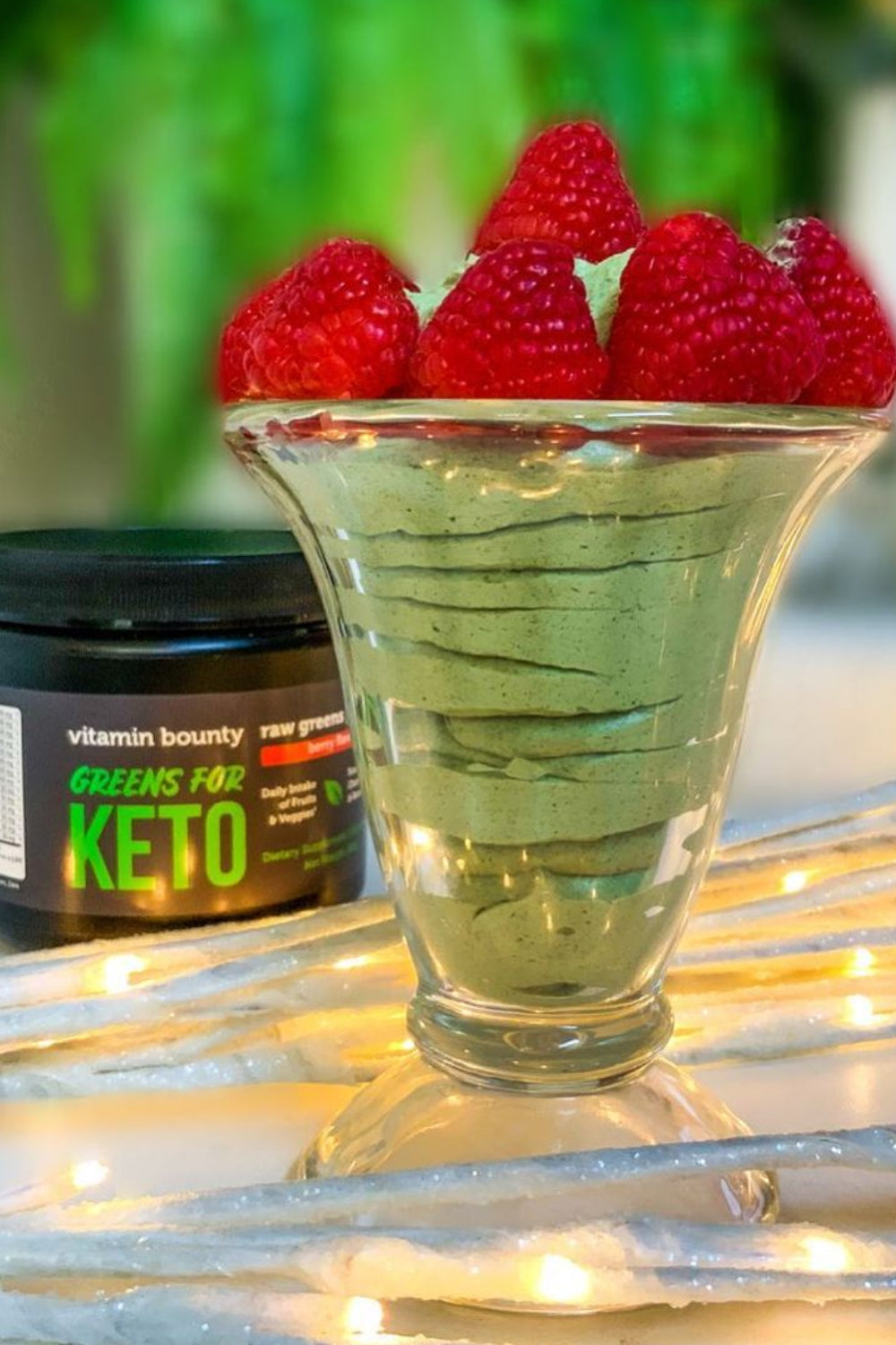 Green mousse topped with raspberries