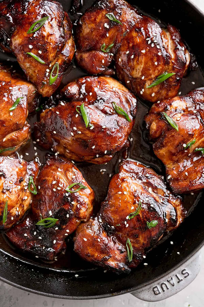 Honey Soy Baked Chicken topped with sesame seeds and green onions