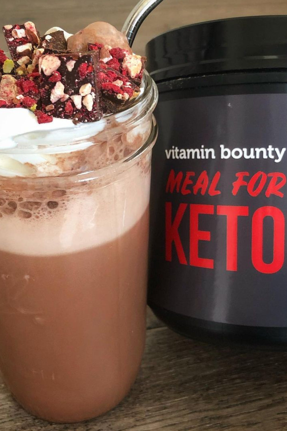 Meal for Keto Chocolate Shake in a mason jae topped with whipped cream and red sprinkles