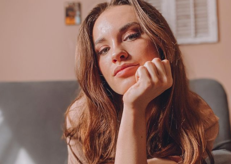 A relaxed head shot about the woman featured in the blog- Kim Evangelista