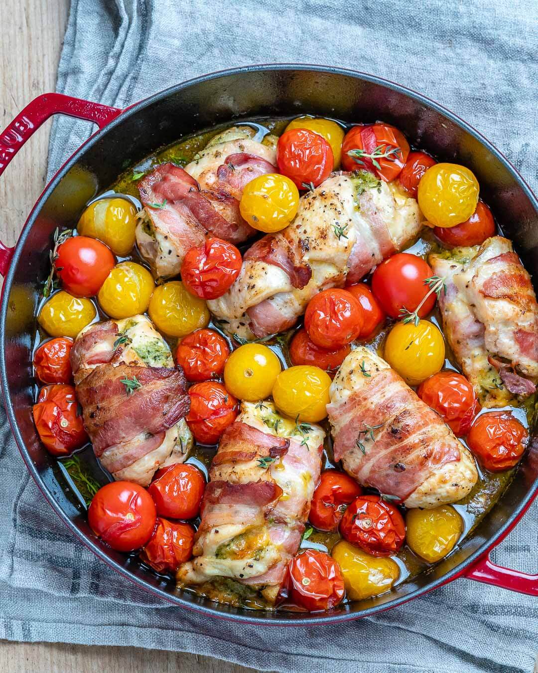 Chicken, Pesto, Bacon Roll Ups in a skillet