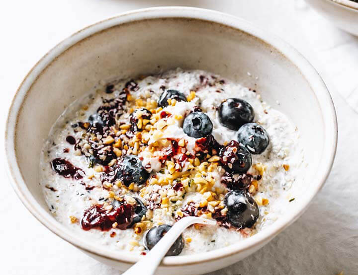 Keto Overnight Oats topped with blueberries and bran