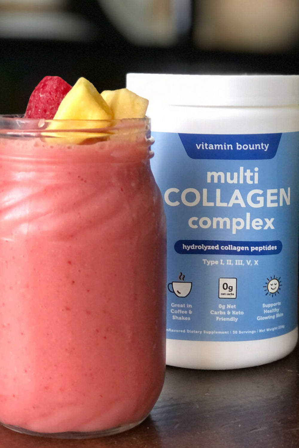 Smoothie in mason jar, topped with fruit and made with Vitamin Bounty Multi Collagen Complex