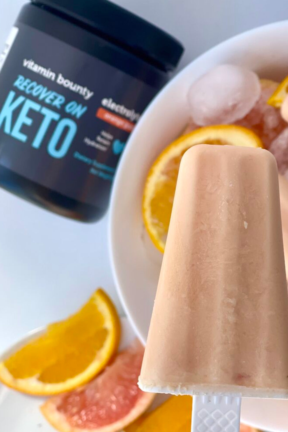 Orange Popsicle made with Vitamin Bounty's Recover on Keto electrolyte popsicles 