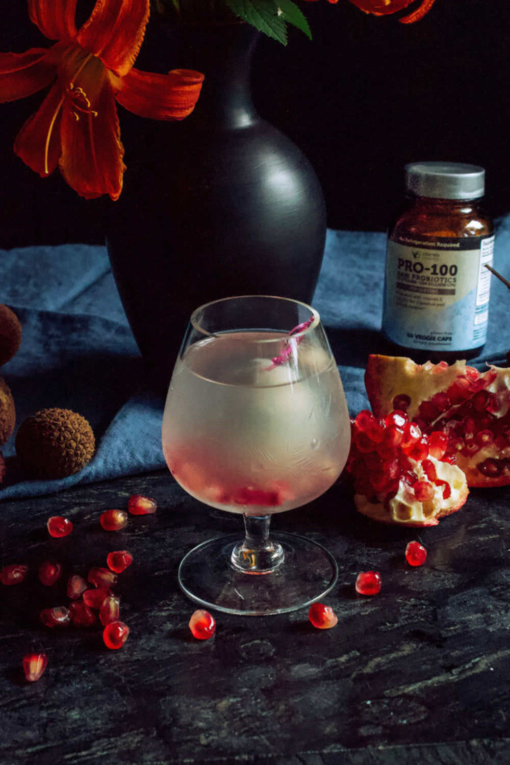 Litchi Coconut Water with Kefir and Pomegranate, photographed in a round cocktail glass 