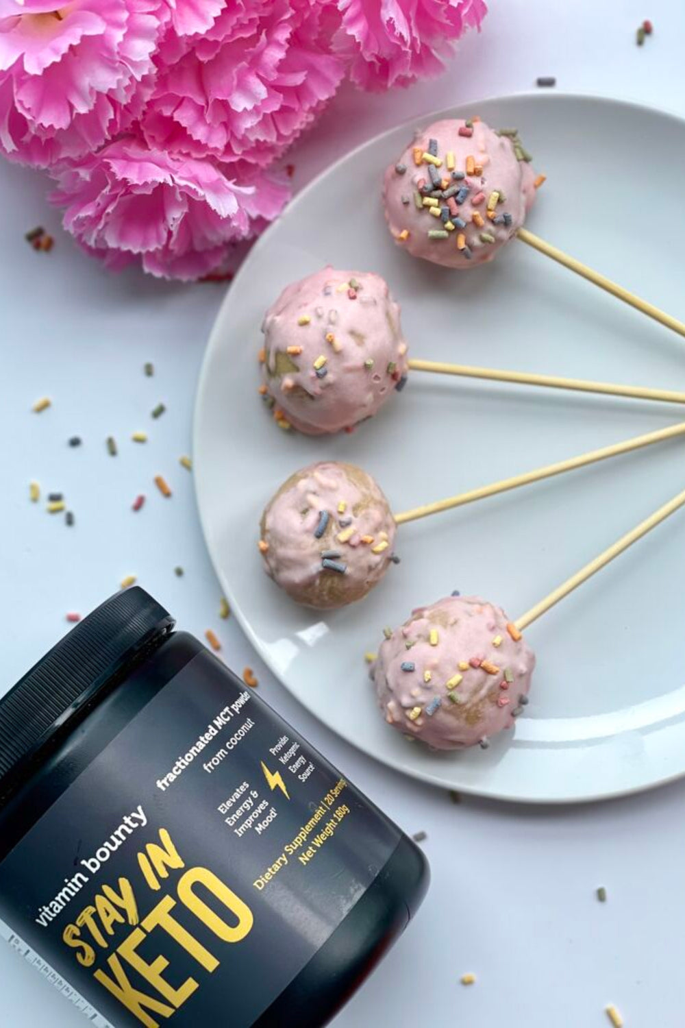 Pink Cake pops with rainbow sprinkles made with Stay in Keto from Vitamin Bounty
