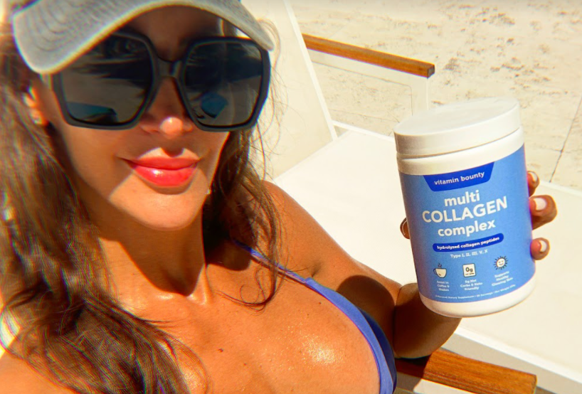 woman on a beach holding Vitamin Bounty Multi Collagen Complex 