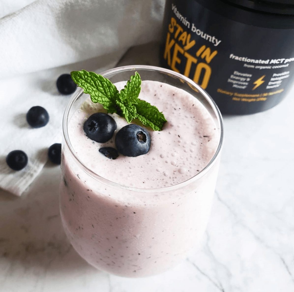 Stay In Keto Blueberry Smoothie topped with mint and blueberries
